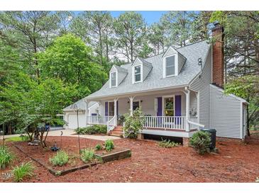 Charming two-story home with a welcoming front porch and well-maintained landscaping at 4953 Tuckahoe Trce, Wake Forest, NC 27587