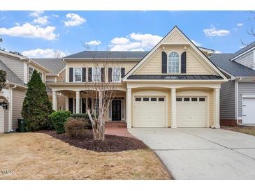 Charming two-story home with a two-car garage and inviting front porch at 5102 Highcroft Dr, Cary, NC 27519