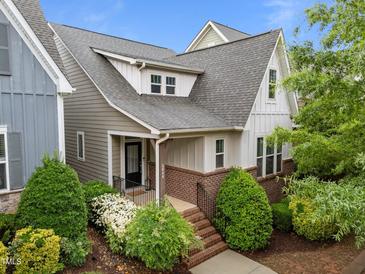 Charming two-story home with manicured landscaping, brick accents, and a welcoming front porch at 5644 Wade Park Blvd, Raleigh, NC 27607