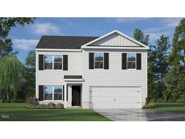 Charming two-story home with white siding, black shutters, and well-manicured front lawn at 7270 Michelle Rd, Rocky Mount, NC 27803