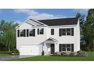 Inviting two-story home with a white exterior, black shutters, and attached two-car garage at 7400 Michelle Rd, Rocky Mount, NC 27803