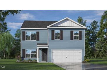 Charming two-story home featuring a classic design and inviting curb appeal with a well manicured lawn at 7416 Michelle Rd, Rocky Mount, NC 27803