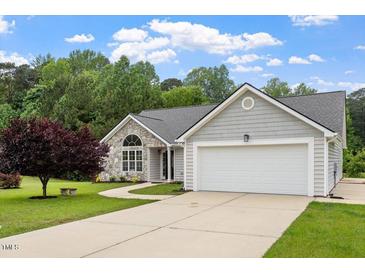 Charming single Gathering home with stone accents and two-car garage at 1969 Bowles Ave, Creedmoor, NC 27522