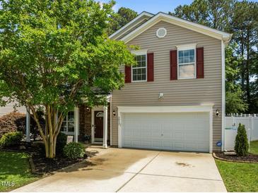 Charming two-story home features a manicured lawn, a two-car garage, and lovely curb appeal at 2012 Sterling Hill Dr, Fuquay Varina, NC 27526
