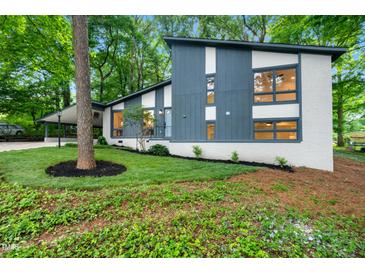 Charming updated home featuring a unique design and beautiful landscaped front yard, providing excellent curb appeal at 4012 Castle Ct, Raleigh, NC 27613