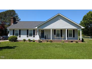 Charming single-story home with a welcoming front porch and well-manicured lawn at 940 Pamela Ln, Rocky Mount, NC 27803
