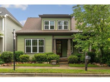 Charming two-story home with a well-manicured lawn and beautiful landscaping at 1930 Briar Chapel Pkwy, Chapel Hill, NC 27516