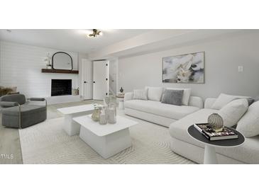 Cozy living room features a fireplace, soft textures, and stylish decor at 4307 Pope Rd, Durham, NC 27707