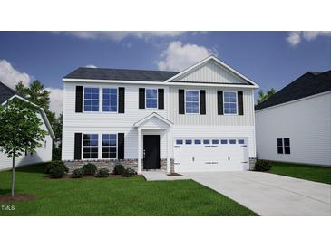Two-story home with black shutters, stone accents and a two car garage at 100 Cordoba Dr, Franklinton, NC 27525