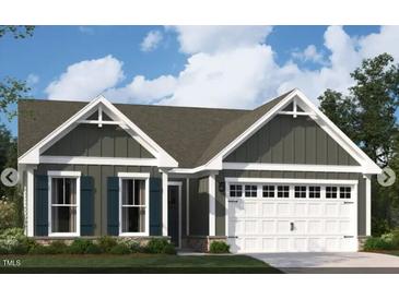 Charming home with a welcoming exterior, complete with a two-car garage and dark-colored shutters at 2000 Kapalua Way # 187, Durham, NC 27703