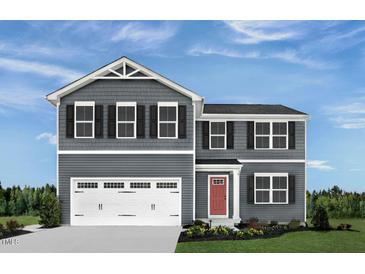 Charming two-story home with gray siding, a red door, and a spacious two-car garage at 260 Day Farm Dr, Lillington, NC 27546