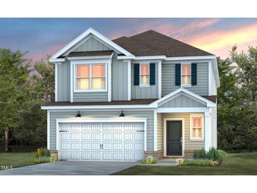Charming two-story home with a gray exterior, white garage door, and well-manicured lawn and landscaping at 2856 Huxley Way, Apex, NC 27502