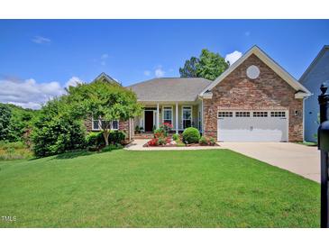 Charming one-story home boasting a beautifully landscaped front yard and stone accents at 372 Farnleigh Dr, Chapel Hill, NC 27517