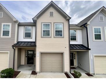 Charming two-story townhouse with neutral siding, attached garage, and covered front porch at 4716 Princess Lita Way, Raleigh, NC 27610