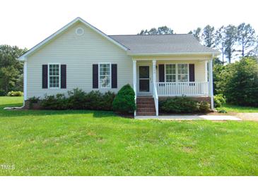 Charming one-story home with a well-manicured lawn and inviting front porch at 3803 Ridgewood Dr, Franklinton, NC 27525