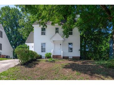 Charming two-story home featuring a classic white exterior and welcoming front porch at 5236 Turf Grass Ct, Raleigh, NC 27610