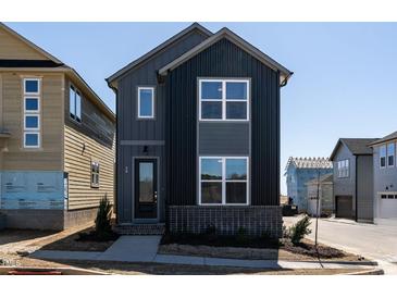 Charming new construction home with a modern design and eye-catching dark siding at 18 Relaxing Way, Pittsboro, NC 27312