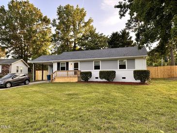 Charming single-story home featuring a welcoming front porch and well-maintained lawn at 2200 Wyman Pl, Durham, NC 27707