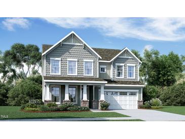 Charming two-story home featuring gray siding, white trim, and a well-manicured front yard at 2964 Hanging Valley Way, Wake Forest, NC 27587