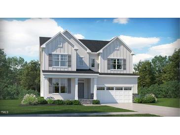 Charming two-story home featuring white siding, gray shutters, and a well-manicured front lawn at 2968 Hanging Valley Way, Wake Forest, NC 27587