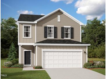 Inviting two-story home with a neutral color scheme, black shutters, and a two car garage at 1201 Solace Way, Rolesville, NC 27571
