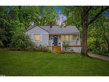 Charming single-story home with a well-manicured lawn and inviting front porch at 2324 Stevens Rd, Raleigh, NC 27610