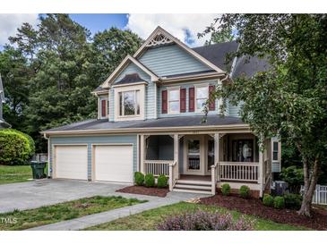 Charming home with a welcoming porch and two-car garage in a beautiful, tree-lined neighborhood at 2617 Charenson Pl, Raleigh, NC 27614