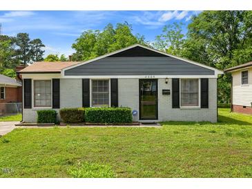 Charming single-story home with a well-maintained lawn and tidy front shrubbery at 2704 Atlantic St, Durham, NC 27707