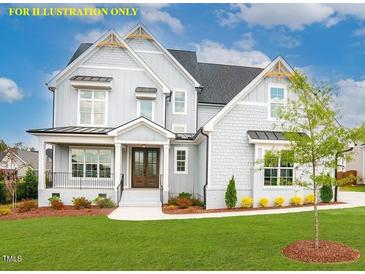 Charming two-story home featuring a mix of board and batten and shake siding, complemented by professional landscaping at 1036 Smoke Willow Way, Rolesville, NC 27571