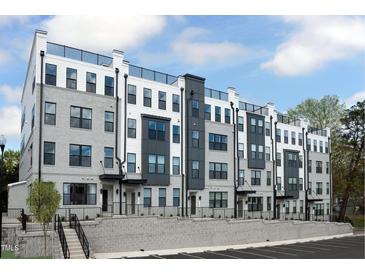 Beautiful new construction townhomes with gray brick and a rooftop deck give this community a modern feel at 101 Ailey Brook Way # 200, Wake Forest, NC 27587