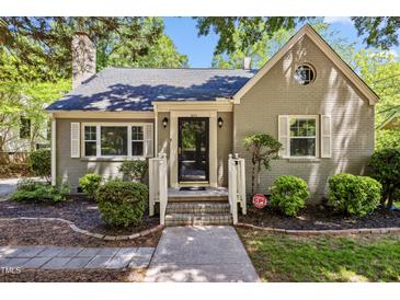 Charming single-story home with a brick facade, landscaped yard, and inviting front entrance at 1304 N Duke St, Durham, NC 27701