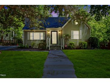 Charming single-story home featuring a manicured lawn and inviting front entrance at 1304 N Duke St, Durham, NC 27701