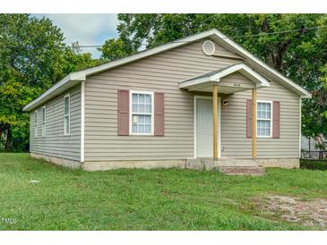 Charming single-story home featuring a cozy front porch and traditional siding at 1416 Betz St, Rocky Mount, NC 27803