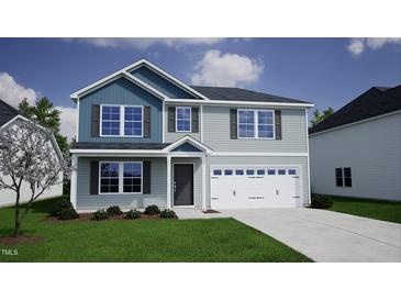 Charming two-story home with a modern design, well-manicured lawn, and an attached two car garage at 228 Alice Trace Place, Angier, NC 27501