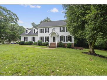 Traditional two-story home featuring a manicured lawn, dormers, and shutters at 2705 Vestry Way, Raleigh, NC 27613