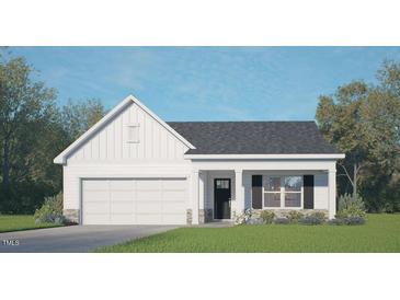 Charming single-story home with a well-manicured lawn, attached garage, and inviting front porch at 806 Comice Pear Way, Willow Springs, NC 27592