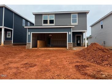 Two-story home showing the garage and gray siding at 829 Ottawa Dr, Garner, NC 27529