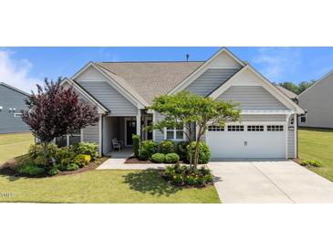 Charming single Gathering home showcasing manicured lawn and a two-car garage at 1112 Monterey Bay Dr, Wake Forest, NC 27587