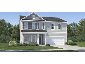 Charming two-story home with a covered front porch, attached two-car garage, and well-maintained lawn at 4308 Hunters Brook Run, Raleigh, NC 27616
