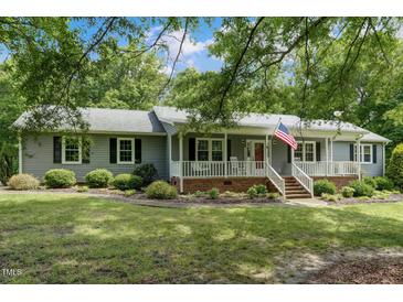 Charming single-story home featuring a welcoming front porch and well-maintained landscaping at 578 Jeffries Cross Rd, Burlington, NC 27217