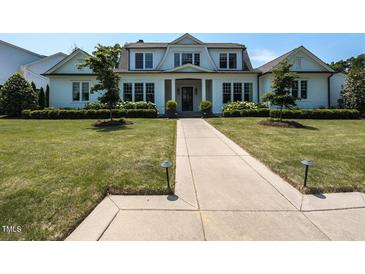 Charming home with a symmetrical facade, manicured lawn, and a welcoming walkway to the front door at 115 Founders Ridge Dr, Chapel Hill, NC 27517
