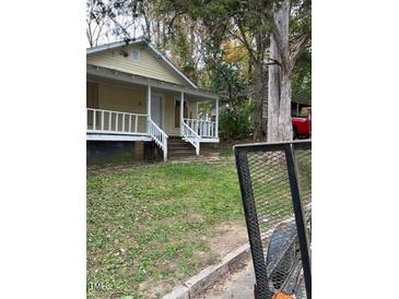 Charming home featuring a quaint front porch, perfect for enjoying the outdoors at 116 Dunstan Ave, Durham, NC 27707