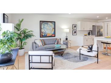 Bright living room featuring stylish furnishings and an open layout, perfect for modern living at 1309 Hudson Ave # D12, Durham, NC 27705