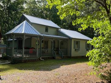 Charming home featuring a gazebo, covered porch and metal roof at 358 Pool Rock Shores Ln, Henderson, NC 27537