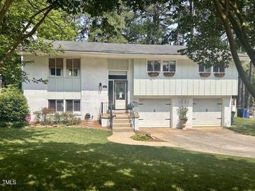 Charming two-story home featuring an attached two-car garage and well-maintained lawn at 3620 Arrowwood Dr, Raleigh, NC 27604