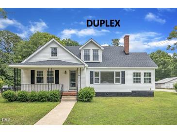 Charming duplex featuring a well-manicured lawn and inviting curb appeal at 302 Hester St, Knightdale, NC 27545