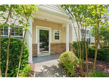 Inviting front entrance with stone accents and well-maintained landscaping at 1003 Crimson Dr, Durham, NC 27713
