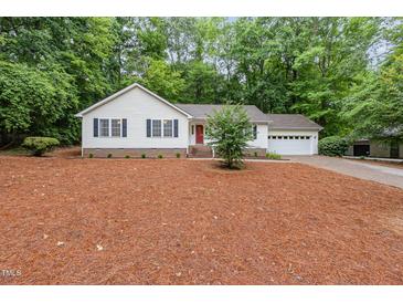 Charming home with a well-manicured lawn, attached garage, and a welcoming front door at 790 Cashmere Ct, Sanford, NC 27332
