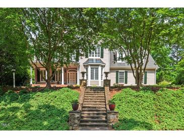 Charming two-story home features an attractive front entrance and lush landscaped yard at 108 Hotelling Ct, Chapel Hill, NC 27514