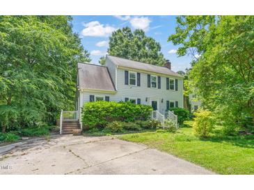 Charming two-story home with a well-maintained lawn and mature trees at 3 Cobble Glen Ct, Durham, NC 27713